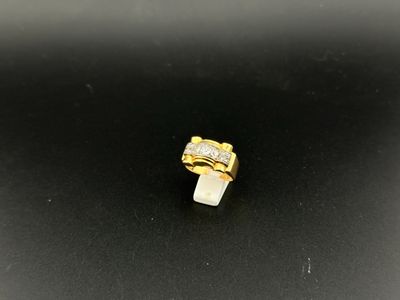 a gold ring with a white stone in the middle