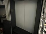 a room with a bed and a closet in it