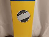 a yellow box with a sticker on it sitting on a white surface