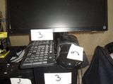 an image of a computer desk with a monitor and keyboard