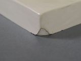a picture of a close up of a corner of a white box