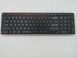 a close up of a keyboard on a white surface