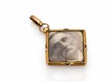 a close up of a picture of a baby in a gold frame