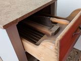 a drawer that has a bunch of tools inside of it