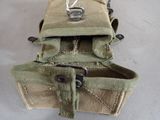a small bag with a metal buckle on it