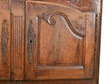a large wooden cabinet with a mirror on top of it