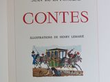 an open book with a picture of a horse drawn carriage on it