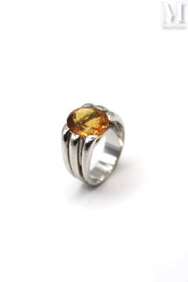 a close up of a ring with a citrine stone on it