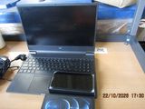 a laptop and a cell phone sitting on a desk