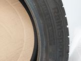 a close up of a tire on a cardboard box on a white surface