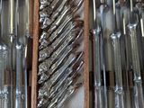 many knives and spoons in a wooden box