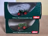 a box with a toy tractor in it sitting on a table