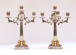 Paire de candélabres en argent (min. 800°/°°) et doré éclairant à