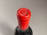 a bottle of wine that is sitting on a table