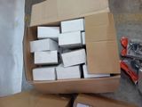 a box full of white boxes sitting on the floor
