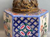 a small decorative box with a lid on a table