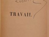 an old book with writing on it sitting on a table