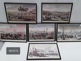 quatre photos encadrées représentant une vue de ville avec une horloge posée sur une table