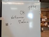 a white refrigerator with writing on it in a warehouse