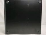 a close up of a black metal plate on a white background