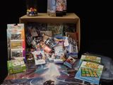 a box full of games and cards on a table