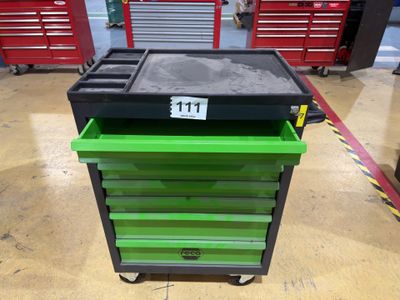 a green and black tool cart sitting on top of a hard wood floor