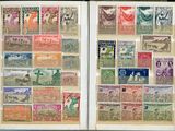 an open book with stamps of different countries on the pages