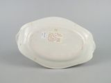 underside view of a porcelain bowl showing the bottom of the bowl and the bottom of the bowl