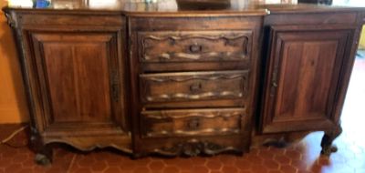 a wooden cabinet with a mirror on top of it