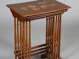 a small wooden table with a floral design on it