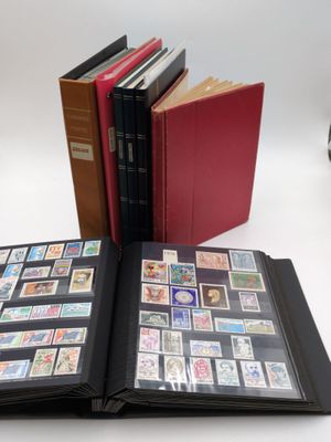a lot of stamps in a book on the table