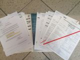 a lot of papers that are on the floor