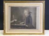 une vieille photo d'un homme assis à un bureau, un stylo à la main