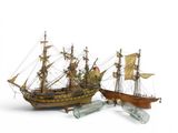 two model ships that are sitting next to each other