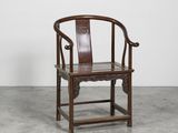 an old wooden chair sitting on top of a cement floor