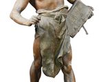an image of a statue of a man holding a newspaper