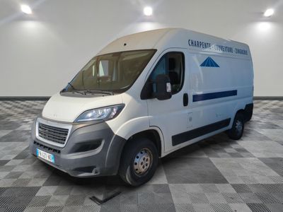 the white van is parked in the empty room of the building