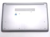 a silver laptop that is open on a white surface