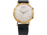an image of a watch with a white dial and black leather strap