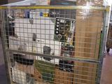 a large cage with a bunch of items inside of it