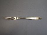 a silver spoon and fork sitting on a table
