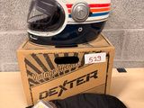 a helmet and a t - shirt sitting on a table