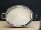 a metal pan with a handle on a table