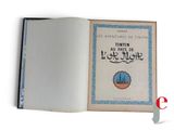 an open book with a picture of a castle on it