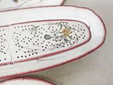 three plates with decorative designs on them sitting on a table