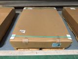 several boxes of cardboard are stacked on a pallet in a warehouse