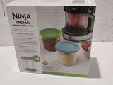 packaging of a small blender with a container of food inside of it