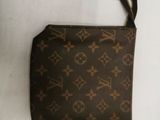louis vuittoupe coin purse in brown and brown