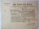 an old document with writing on it sitting on a table