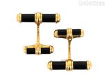 two pairs of black and gold cufflinks with gold accents